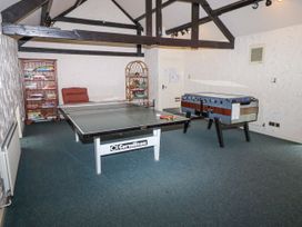 A game room with a table tennis table and foosball table at Catkin Cottage Akeld near Wooler