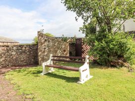A bench in a garden at The Columbine Akeld near Wooler