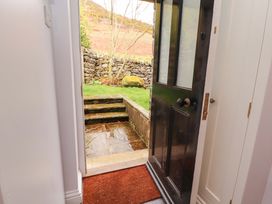 An entrance with an open door leading to steps and a garden at Two Town End in Mungrisdale, Mosedale