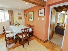 A dining room with a table and chairs at Two Town End in Mungrisdale, Mosedale