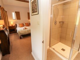 A bedroom with a shower area at Two Town End in Mungrisdale, Mosedale
