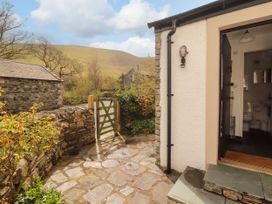 An outdoor area with a stone path and a gate at Two Town End Mungrisdale, Mosedale