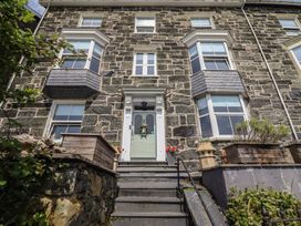 An entrance with steps and windows at 5 Porkington Terrace in Barmouth