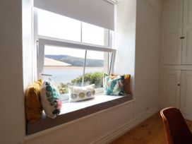 A window seat with cushions at 5 Porkington Terrace in Barmouth