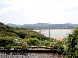 A view of sea and mountains from a garden at 5 Porkington Terrace Barmouth