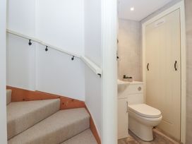 A bathroom with a sink and toilet at Wrens Nest in Slapton