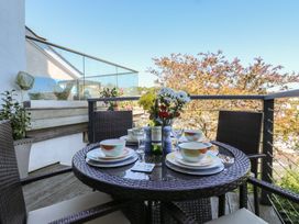 A balcony table set for dining at 46 Crowthers Hill in Dartmouth