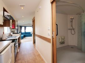 A kitchen with a shower area at Abbey View @ Summerfield Farm in Hawsker
