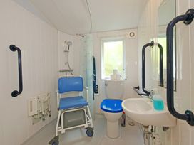 A bathroom with a sink and toilet at Abbey View @ Summerfield Farm, Hawsker