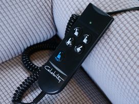 A remote control with buttons for a reclining chair at Abbey View @ Summerfield Farm, Hawsker
