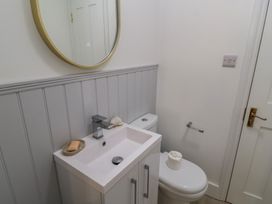 A bathroom with a sink and toilet at Still Waters in Swanage