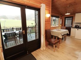 A dining area with a table and chairs at The Fold near Number 28, Burnside Park near Keswick