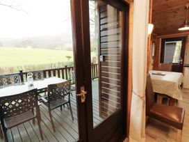 A dining room with a table and chairs at The Fold Number 28, Burnside Park near Keswick