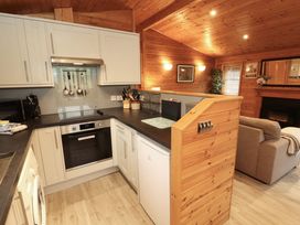 A kitchen with cabinets and appliances at The Fold near Number 28, Burnside Park near Keswick