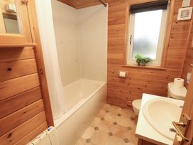 A bathroom with a bathtub and a sink at The Fold near Keswick