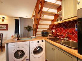 A kitchen with washing machine and dryer at Albany @ Summerfield Farm, Hawsker
