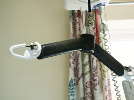 An overhead hoist with a hook in a room at Albany @ Summerfield Farm Hawsker