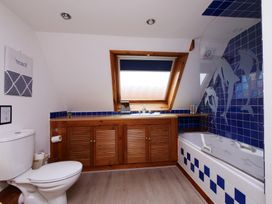 A bathroom with a toilet, sink, and bathtub at Albany @ Summerfield Farm in Hawsker