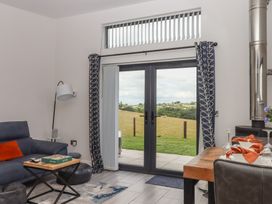 A living room with a sofa and coffee table at The Cadeleigh near Tiverton