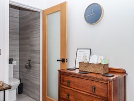 A bathroom with a toilet and sink at The Cadeleigh near Tiverton