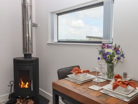 A dining room with a table set for a meal at The Cadeleigh near Tiverton
