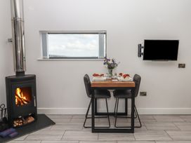 A dining area with a table and chairs at The Cadeleigh near Tiverton