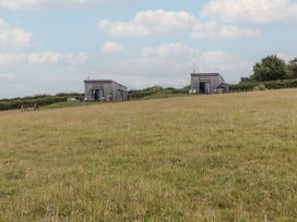 Two buildings on a grassy field at The Cadeleigh in Cadeleigh near Tiverton