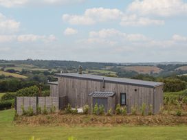A house with a fence and land at The Cadeleigh near Tiverton