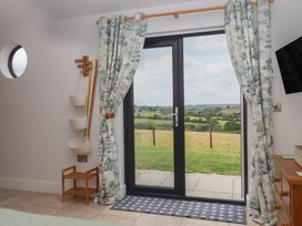 A room with a door leading to a view at The Pennymoor in Cadeleigh near Tiverton