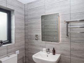 A bathroom with a sink and a mirror at The Pennymoor in Cadeleigh near Tiverton
