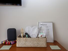 A living room setup with a welcome note and amenities at The Pennymoor in Cadeleigh near Tiverton