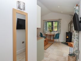 A living room with a table and chairs at The Pennymoor in Cadeleigh near Tiverton