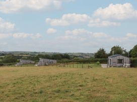 A view of several houses on grassland at The Pennymoor in Cadeleigh near Tiverton