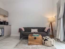 A living room with a couch and coffee table at The Bickleigh Cadeleigh near Tiverton