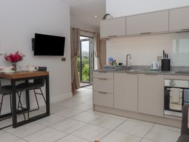 A kitchen with a dining table and chairs at The Bickleigh in Cadeleigh near Tiverton