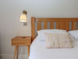 A bedroom with a bed and bedside table at The Bickleigh Cadeleigh near Tiverton