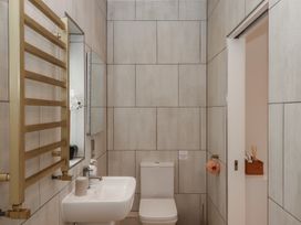 A bathroom with a toilet and sink at The Bickleigh in Cadeleigh near Tiverton