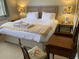 A bedroom with a bed and bedside table at Greywalls in Maulds Meaburn