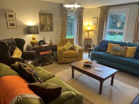 A living room with sofas and a coffee table at Greywalls in Maulds Meaburn