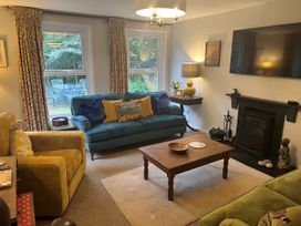A living room with a sofa and television at Greywalls in Maulds Meaburn