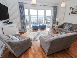 A living room with sofas and a television at Tremorna Vista in Carbis Bay