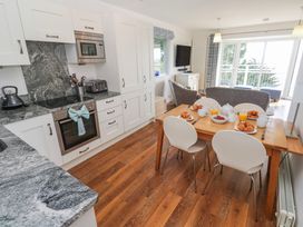 A kitchen with dining area at Tremorna Vista in Carbis Bay
