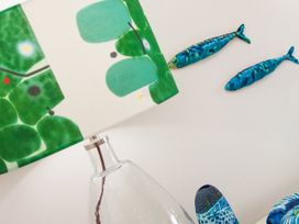 A lamp and ceramic fish decor at Ultramarine in Carbis Bay