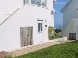 An outdoor area with a door and garden at Atlantic Waves in Carbis Bay