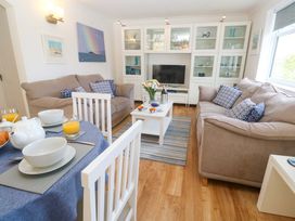 A living room with a sofa and coffee table at Atlantic Waves in Carbis Bay