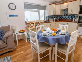 A dining area with table and chairs at Atlantic Waves in Carbis Bay