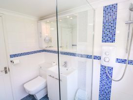 A bathroom featuring a shower, sink, and toilet at Atlantic Waves in Carbis Bay