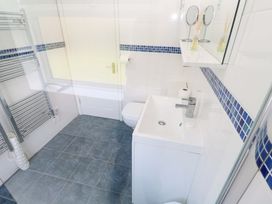 A bathroom with a sink, toilet, and towel rail at Atlantic Waves in Carbis Bay