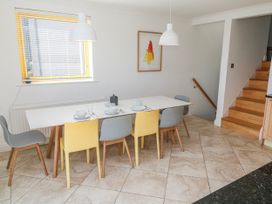 A dining room with a table and chairs at Bayside in Carbis Bay