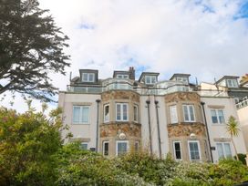 A building with windows and a balcony at Ocean Gem in Carbis Bay